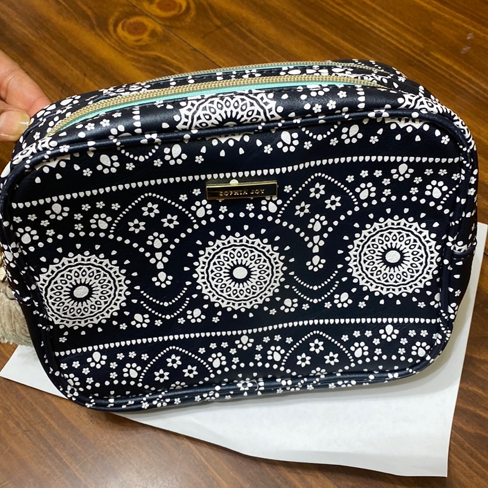 Sophia joy , cosmetics bag , black and white color.